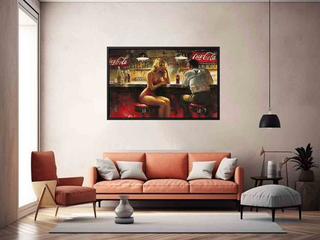 Living room with a framed Coca-Cola advertisement on the wall above an orange sofa.