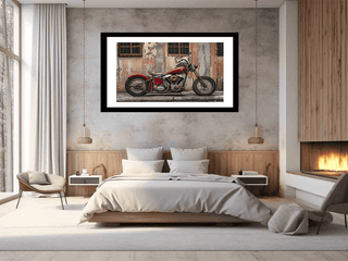 Framed photograph of a red motorcycle on a wall above a bed in a modern bedroom.