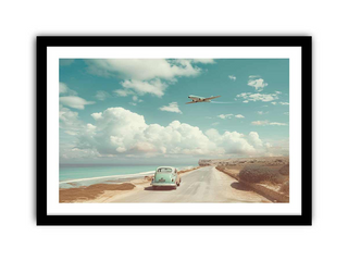 Vintage car on a road by the sea with an airplane flying overhead, framed in black.