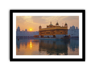 Framed photograph of the Golden Temple at sunset with a reflection in the water.