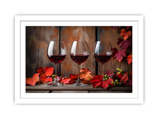 Three wine glasses with red wine on a wooden surface with autumn leaves and berries.