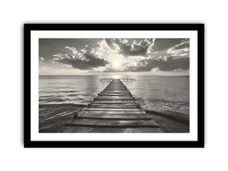 Framed black and white photograph of a wooden pier extending into the water with dramatic clouds above.