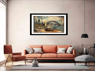 Framed artwork of a cityscape with a bridge hanging above a sofa in a living room.