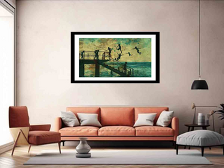 Living room with a framed artwork above an orange sofa