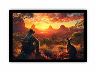 Man in a hat sitting on a rock with a kangaroo, looking at a sunset over a desert landscape.
