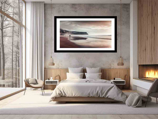 Modern bedroom with a large bed, wall art, and fireplace.