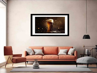 Framed artwork of a beer glass on a wall above a sofa in a living room.