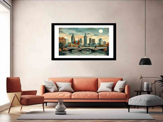 Framed artwork of a cityscape hanging above an orange sofa in a living room.
