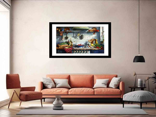Framed artwork of a kitchen scene above an orange sofa in a living room.
