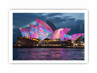 Sydney Opera House with colorful lights at night